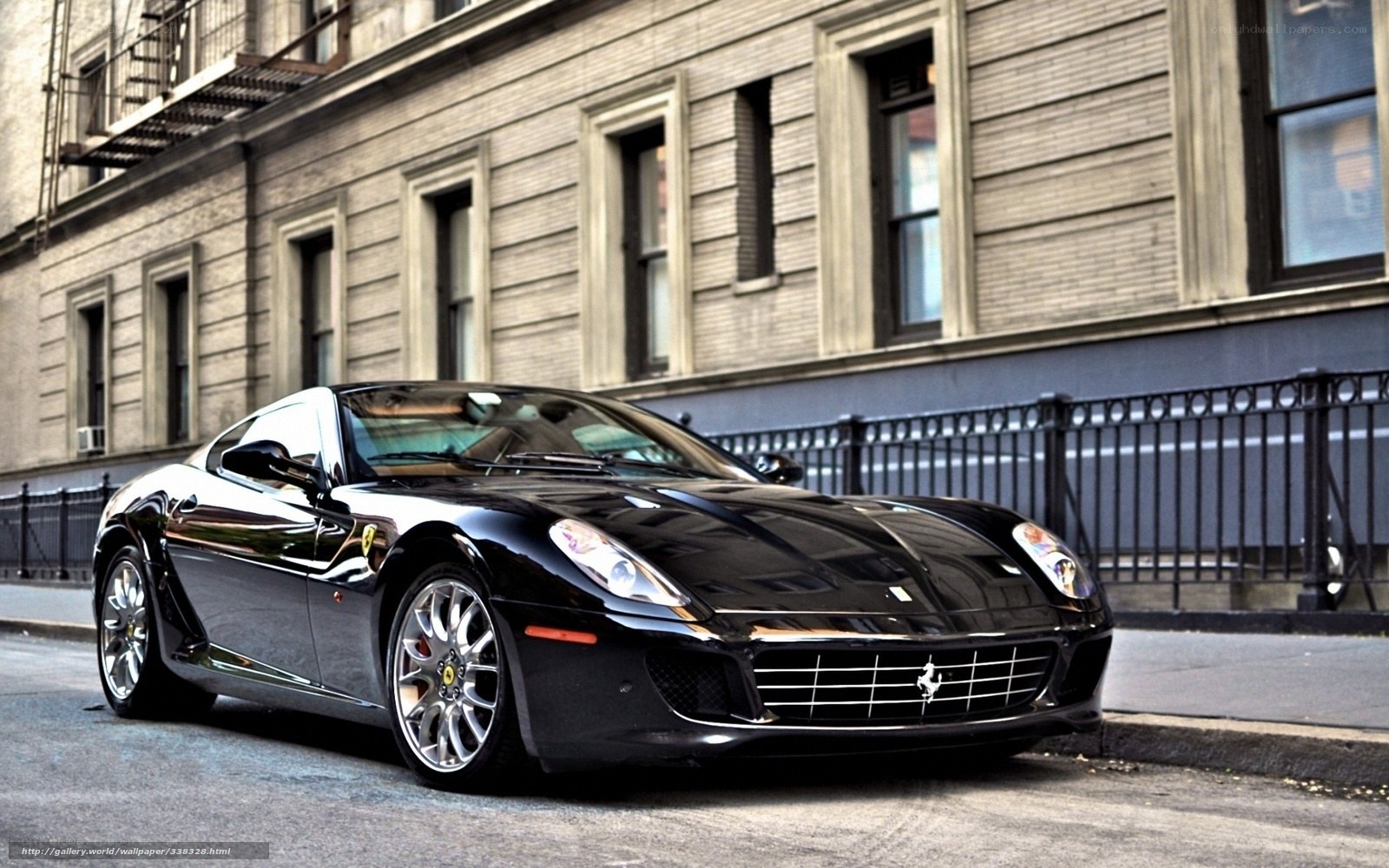 Black Ferrari parked on city street