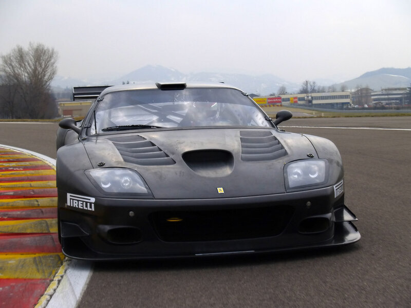 Black Ferrari race car on track
