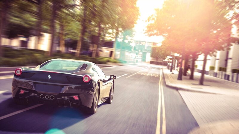 Black Ferrari Sports Car — Dynamic, Afternoon, Photograph