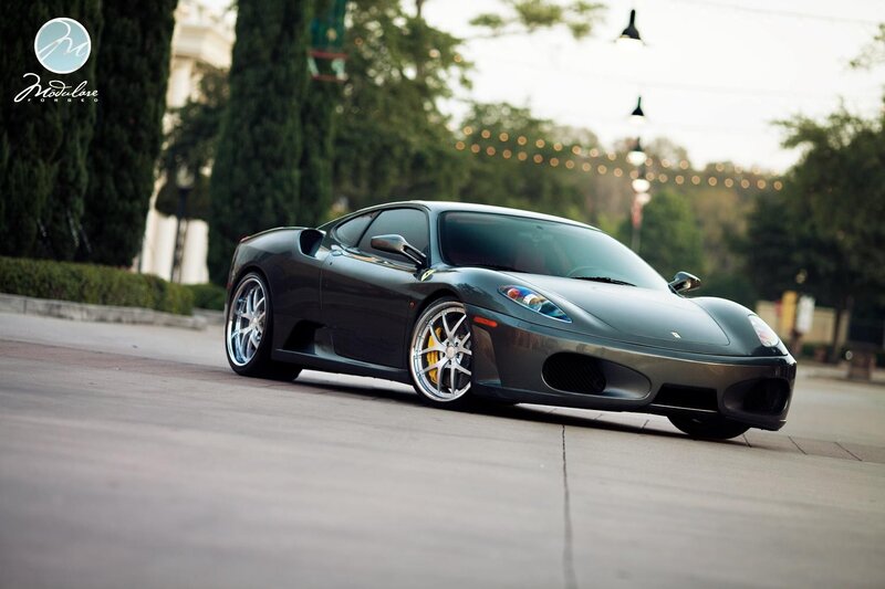Black Ferrari sports car on street