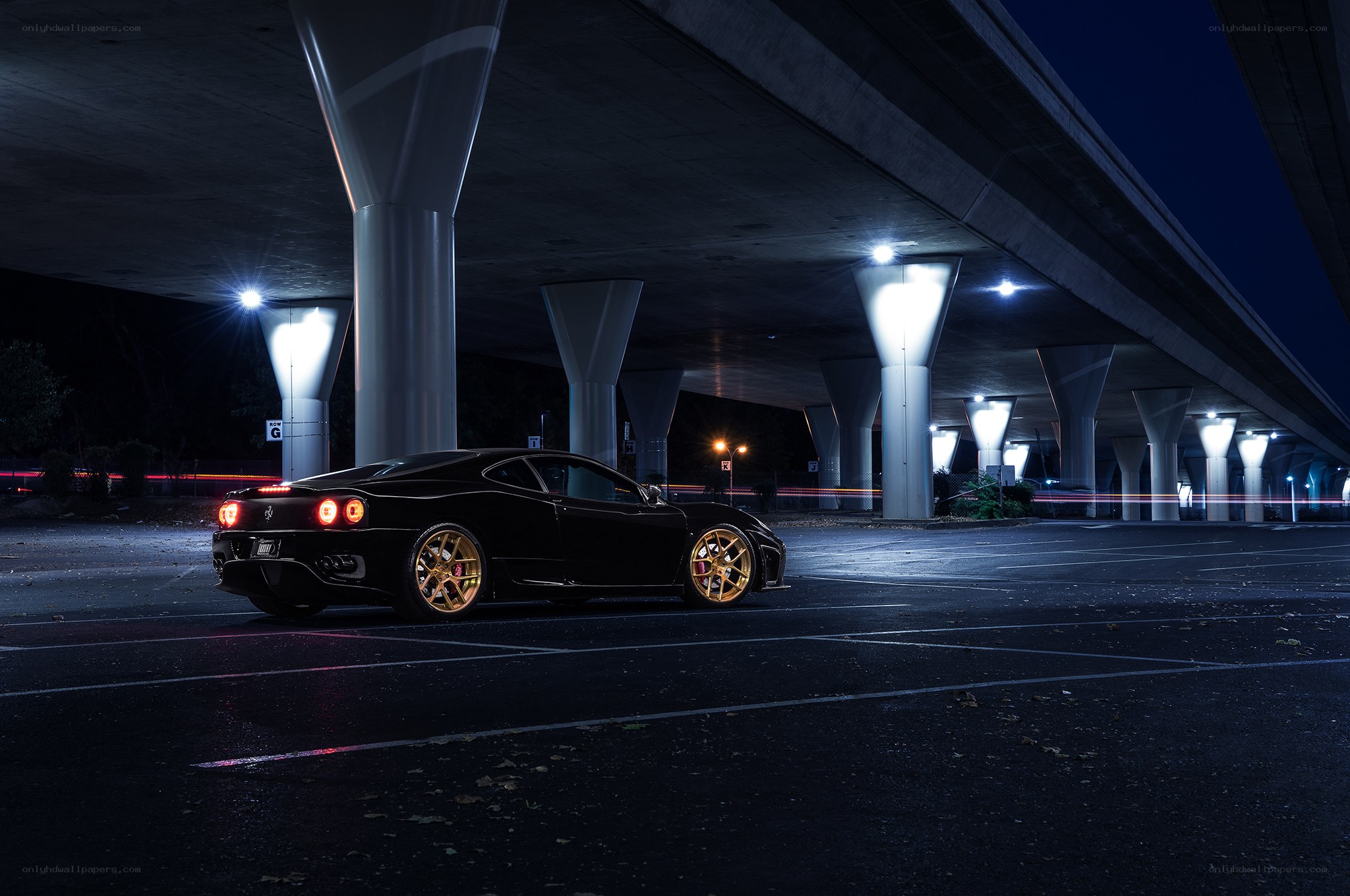 Black Ferrari under highway