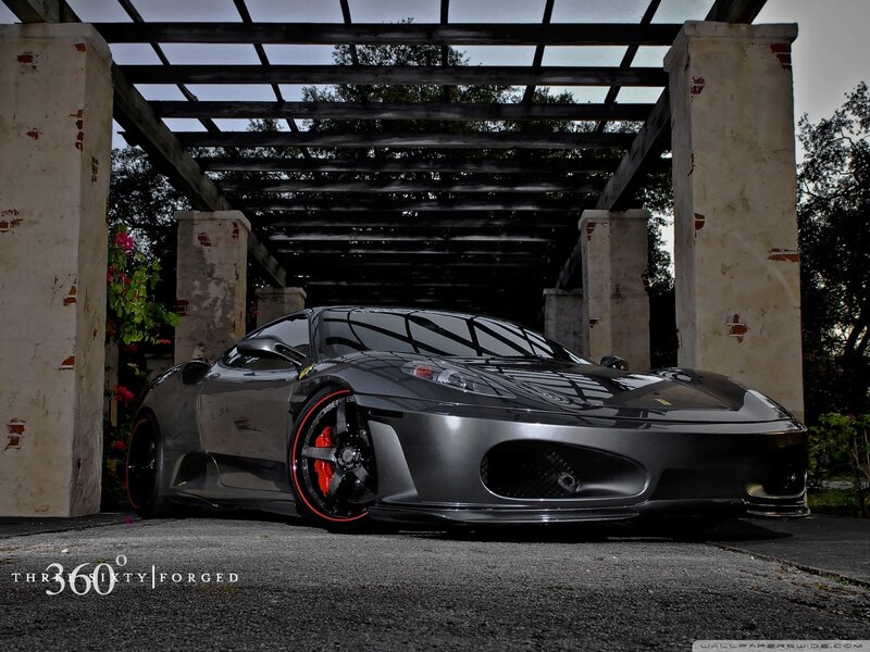 Black Ferrari under pergola