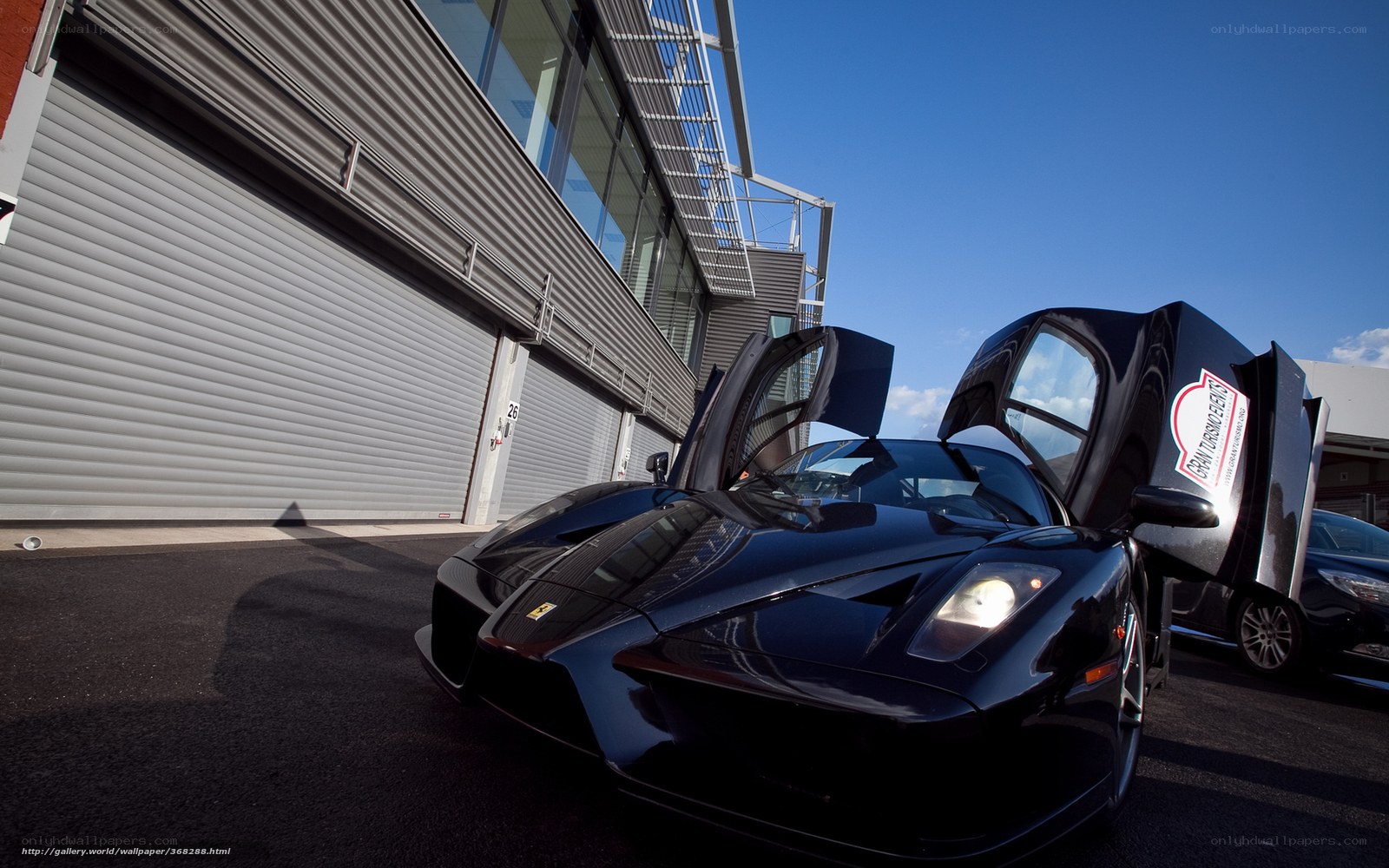 Black Ferrari with doors open
