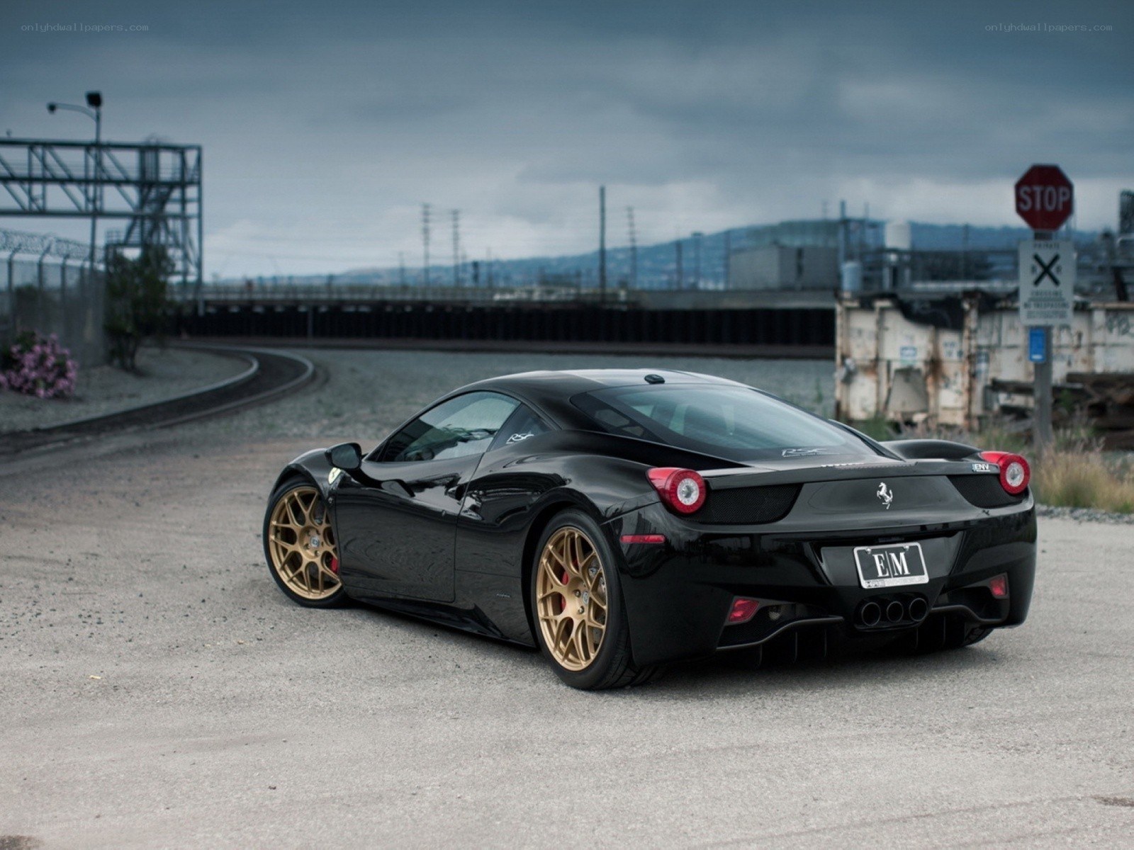 Black Ferrari with gold wheels