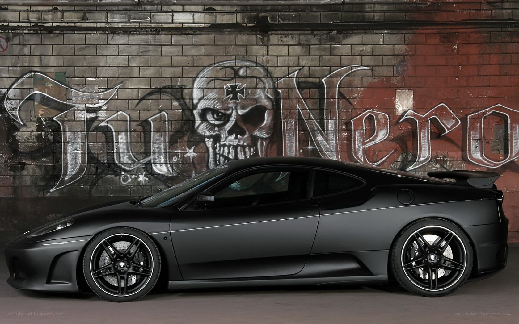 Black Ferrari with graffiti art