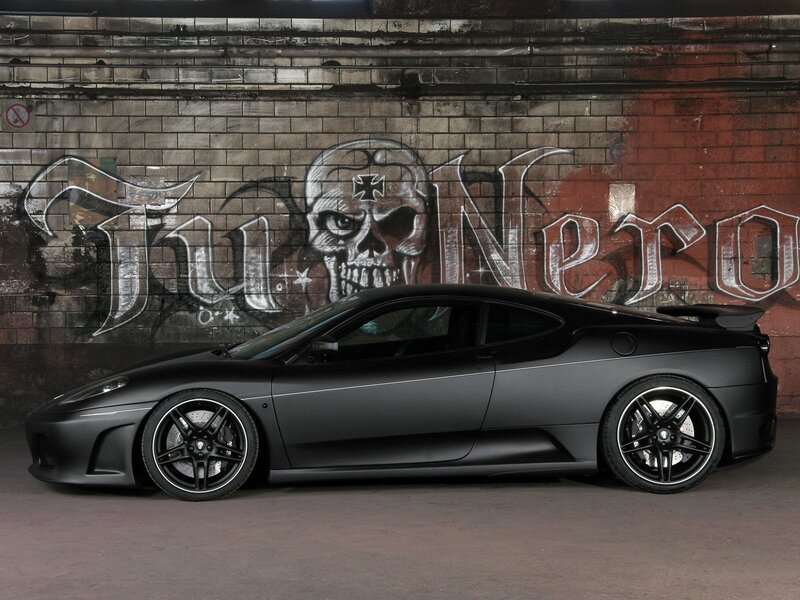 Black Ferrari with graffiti backdrop