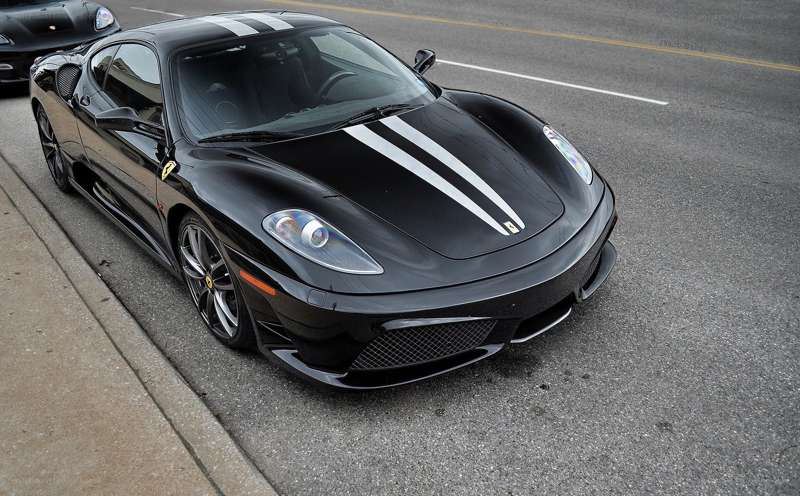 Black Ferrari with racing stripes