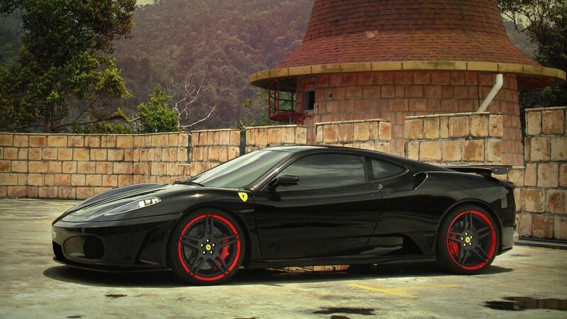 Black Ferrari with red wheels