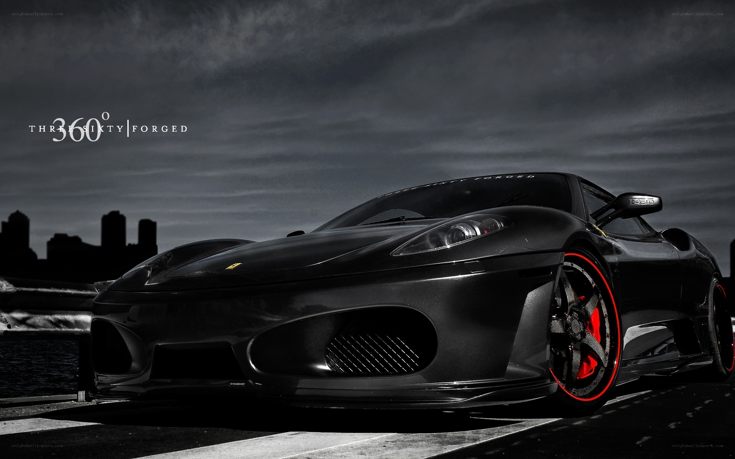 Black Ferrari with red wheels