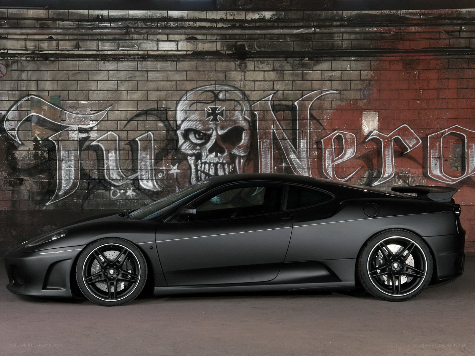 Black Ferrari with skull graffiti