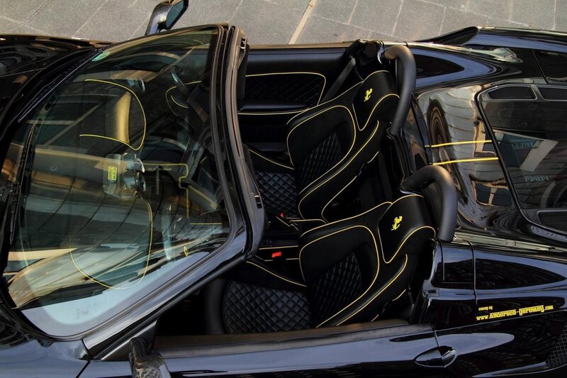 Black Ferrari with yellow stitching