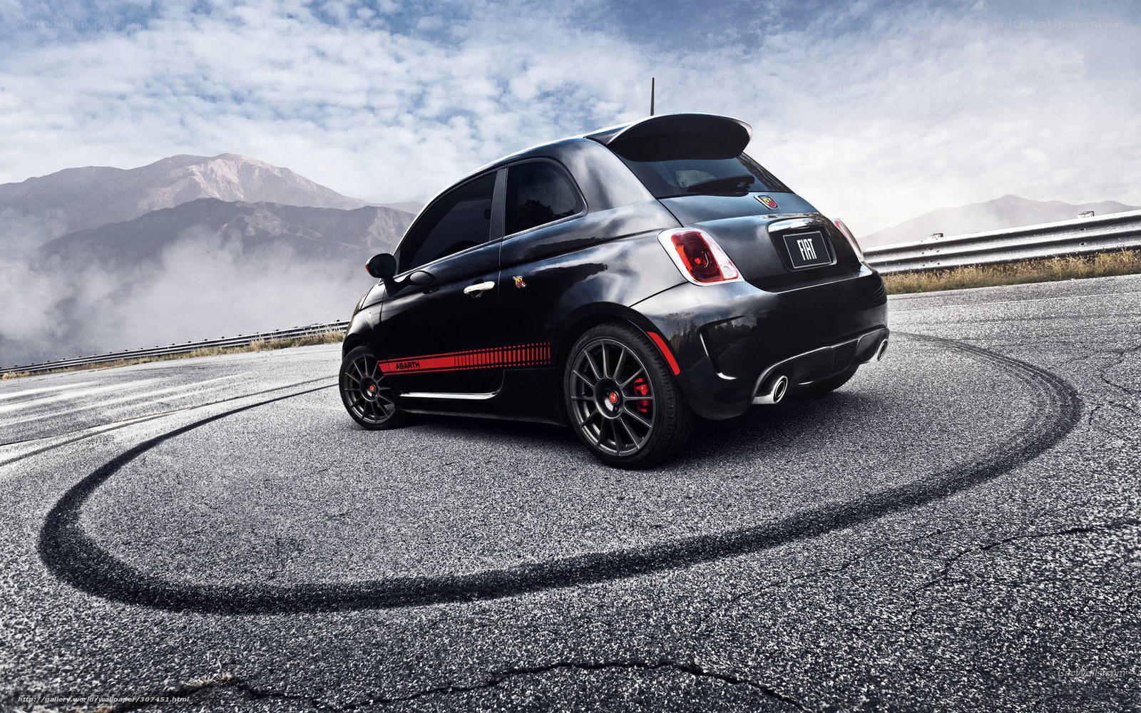Black Fiat 500 Abarth on mountain road
