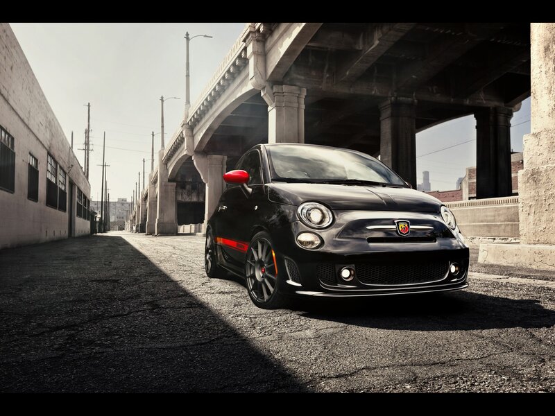 Black Fiat 500 Abarth under bridge