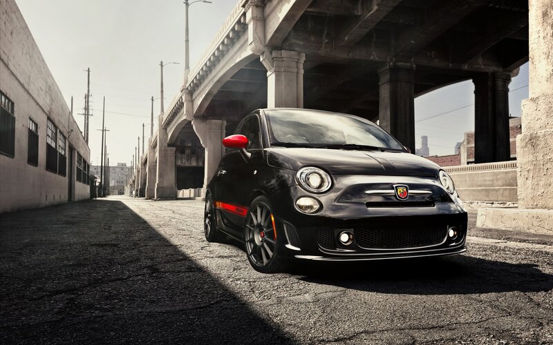 Black Fiat 500 Abarth under bridge
