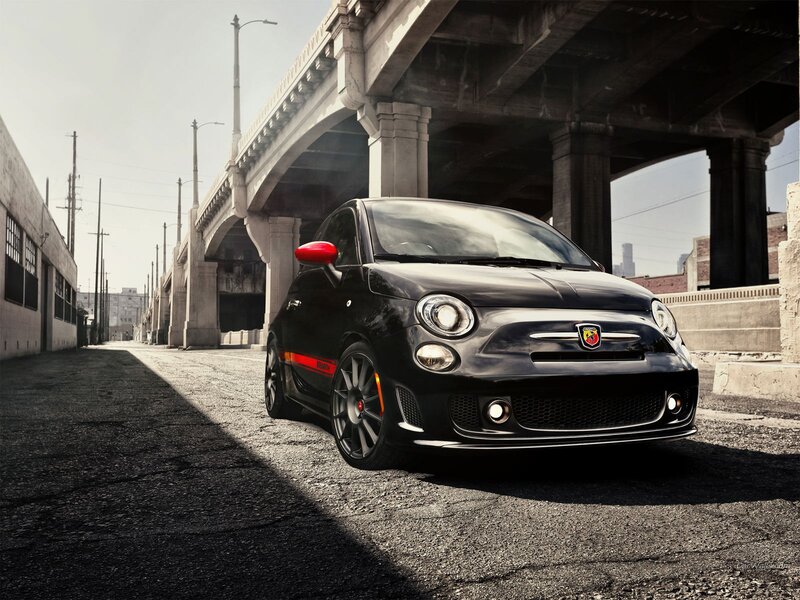 Black Fiat 500 Abarth under bridge