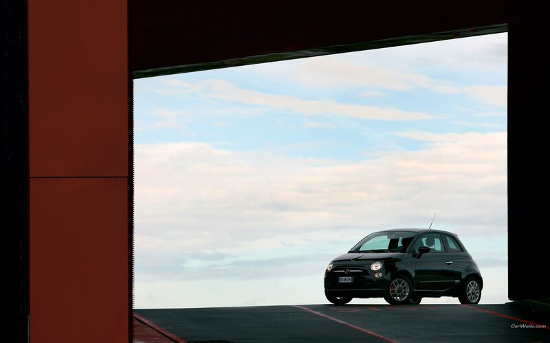 Black Fiat 500 in parking garage