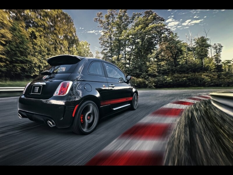 Black Fiat Abarth on a racetrack