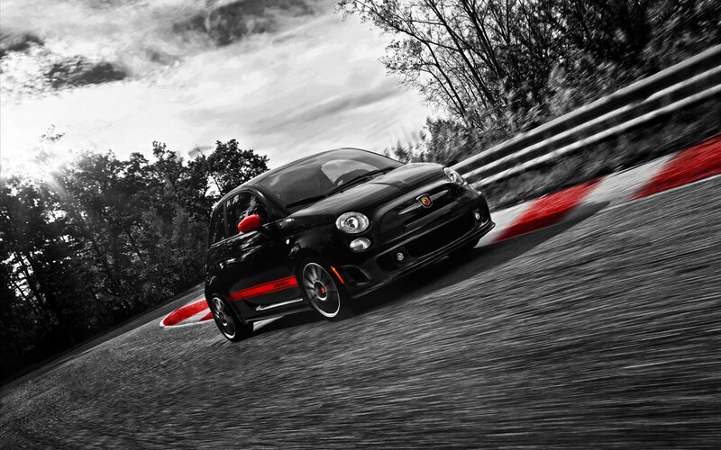Black Fiat Abarth on a racetrack
