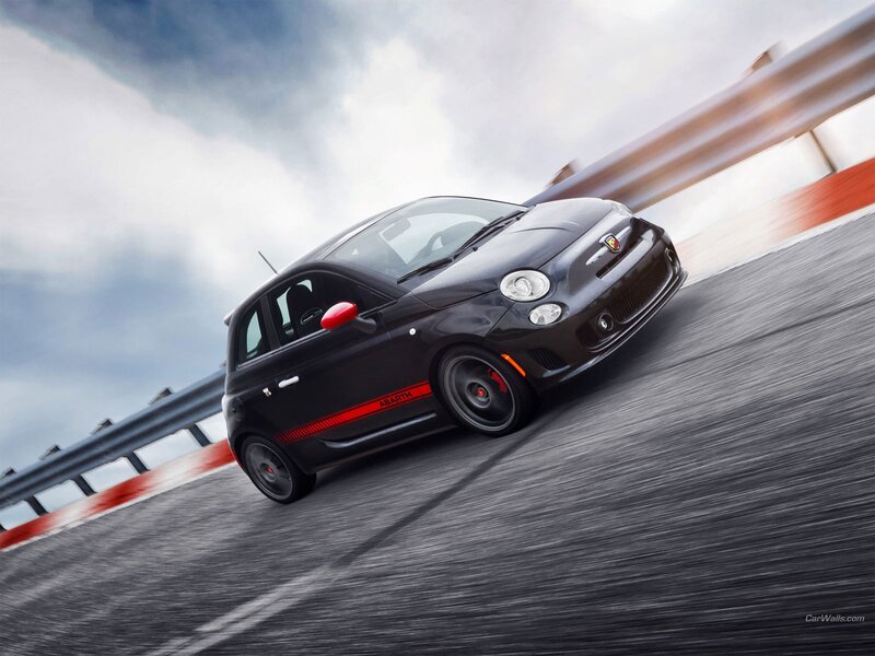 Black Fiat Abarth on a racetrack