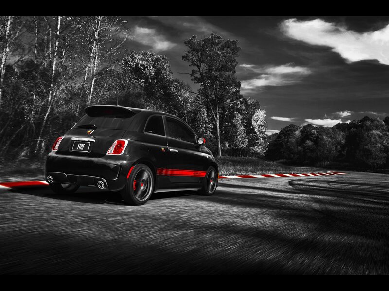 Black Fiat Abarth on a racetrack