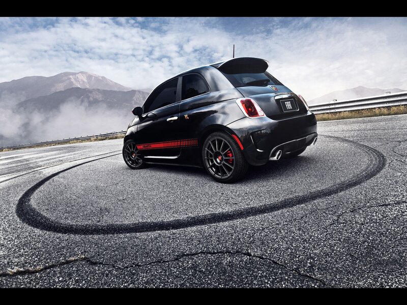 Black Fiat Abarth on mountain road