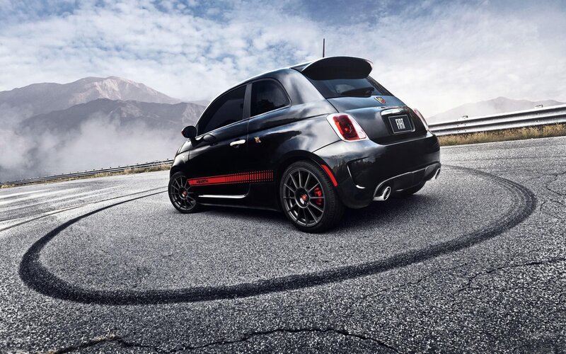 Black Fiat Abarth on mountain road