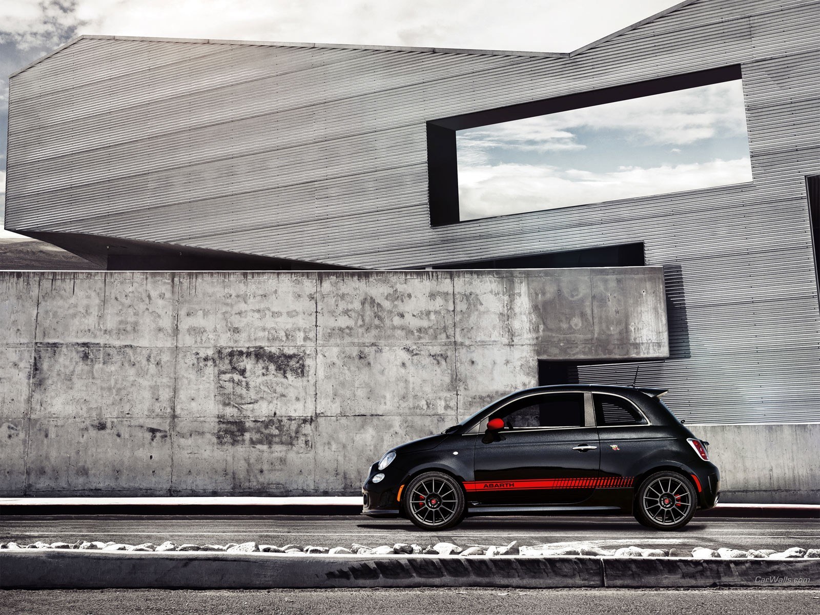 Black Fiat Abarth parked outside