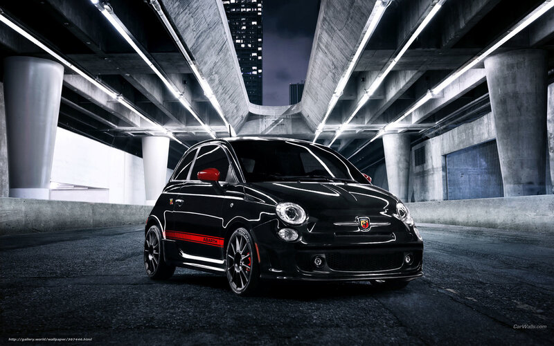 Black Fiat Abarth under bridge