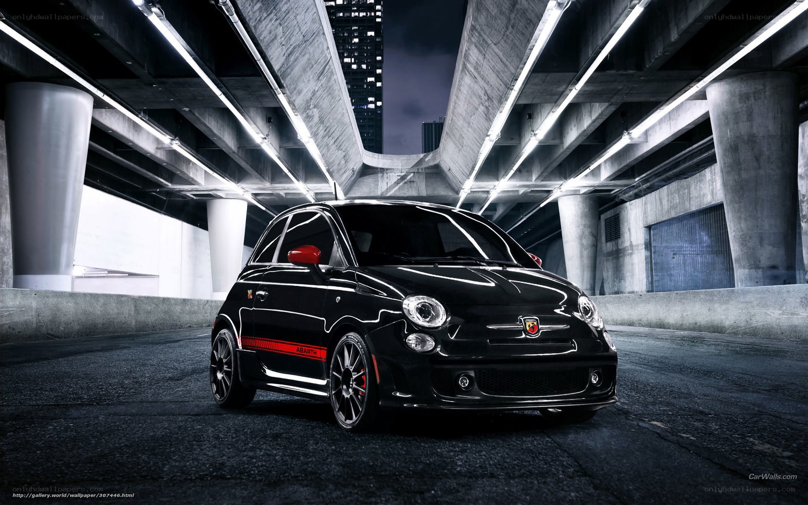 Black Fiat Abarth under bridge
