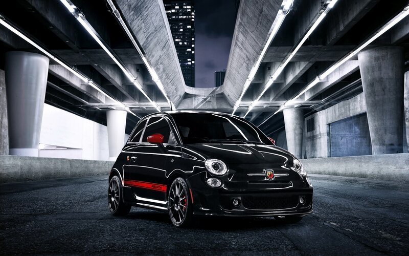 Black Fiat Abarth under highway
