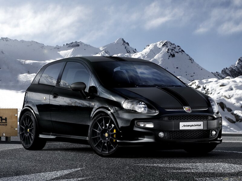 Black Fiat Scorpion in snowy mountains