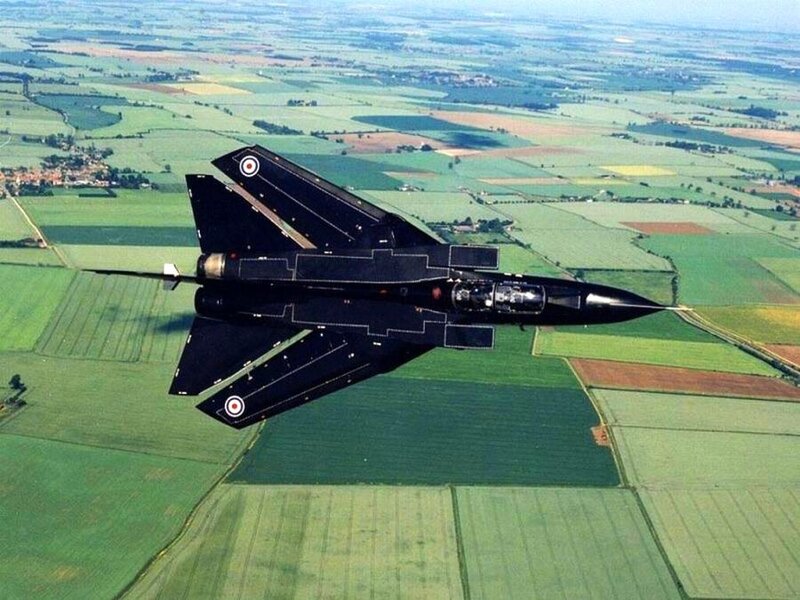 Black fighter jet in flight