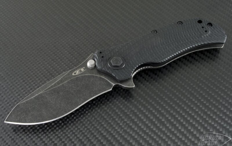 Black Folding Knife — Neutral, Photograph, Carbon Fiber Surface