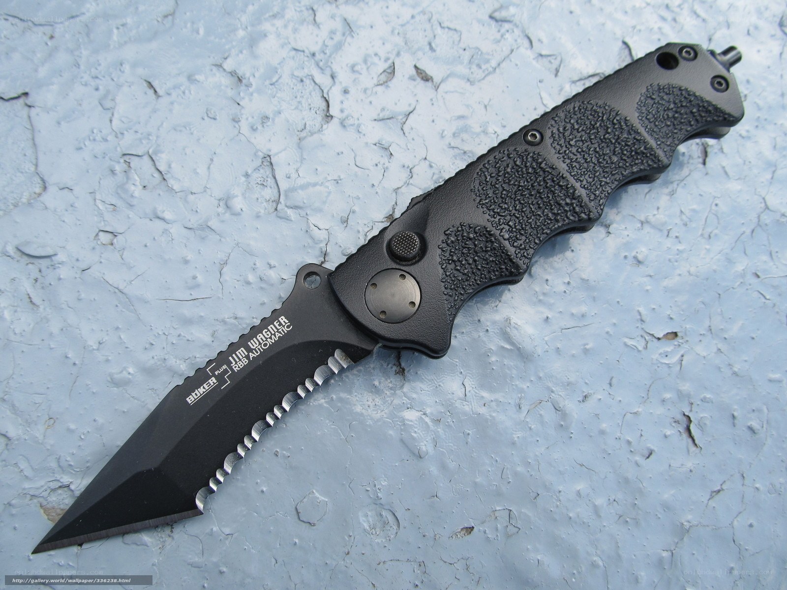 black folding knife on concrete