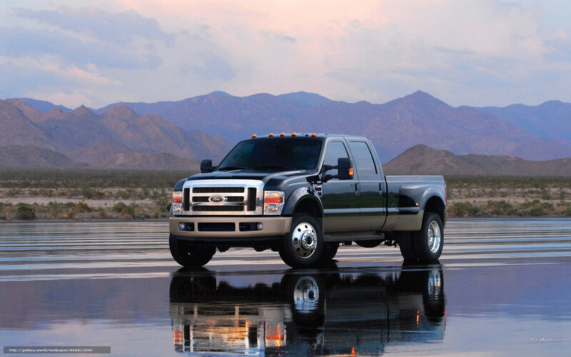 Black Ford F-250 on wet road