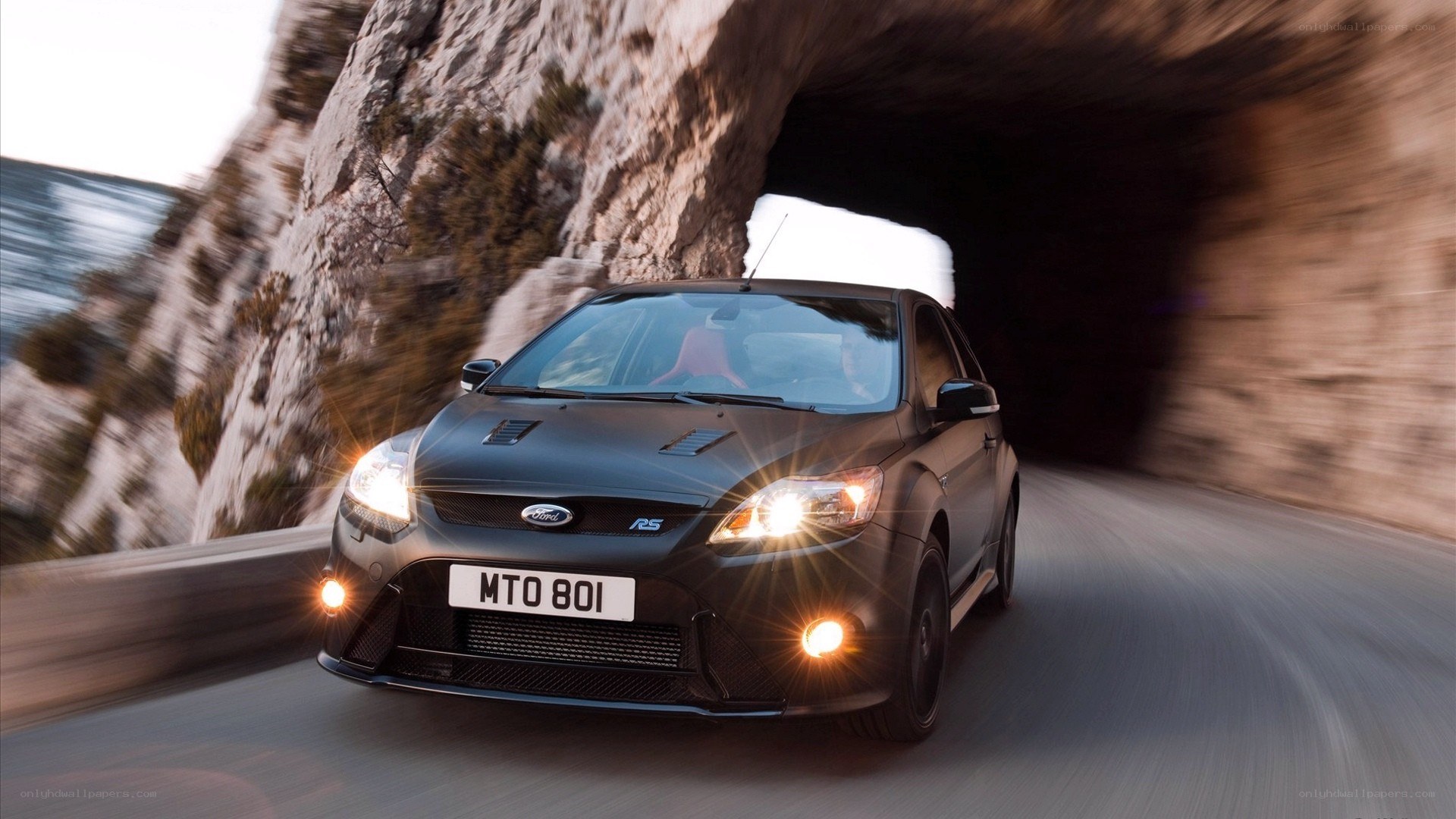 Black Ford Focus RS exiting tunnel
