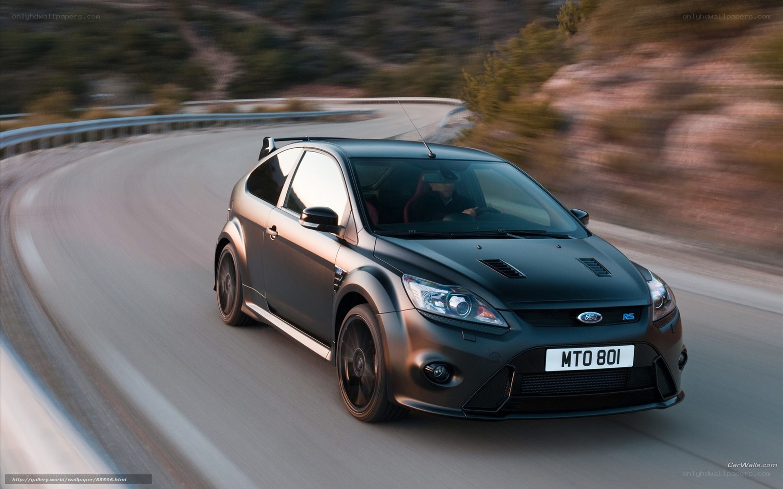 black ford focus rs on winding road