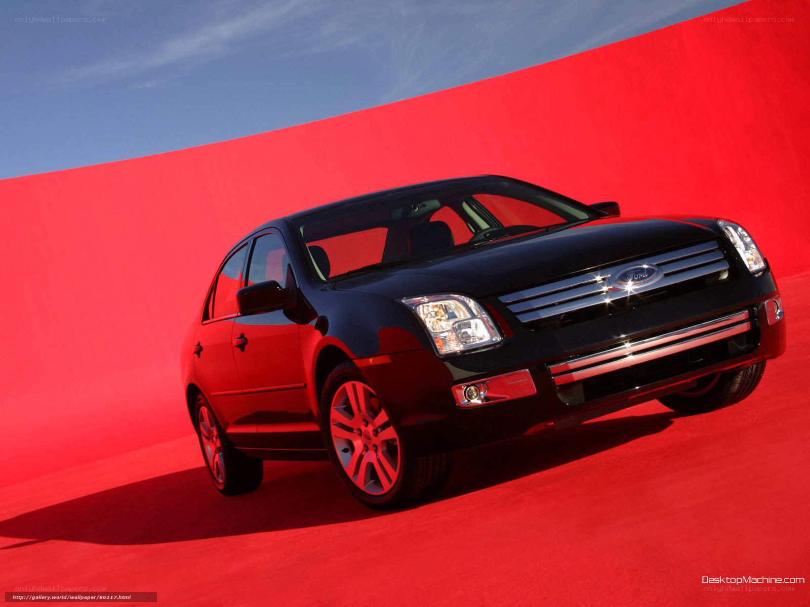 Black Ford Fusion on red background