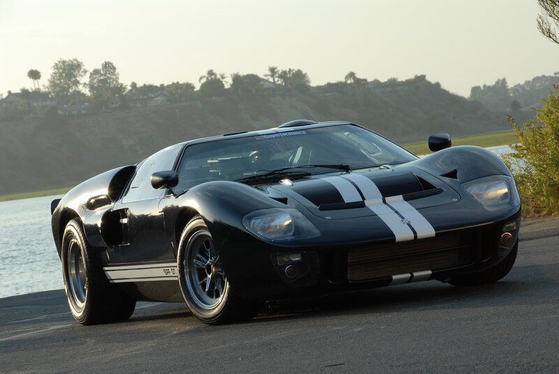 Black Ford GT40 on a coastal road