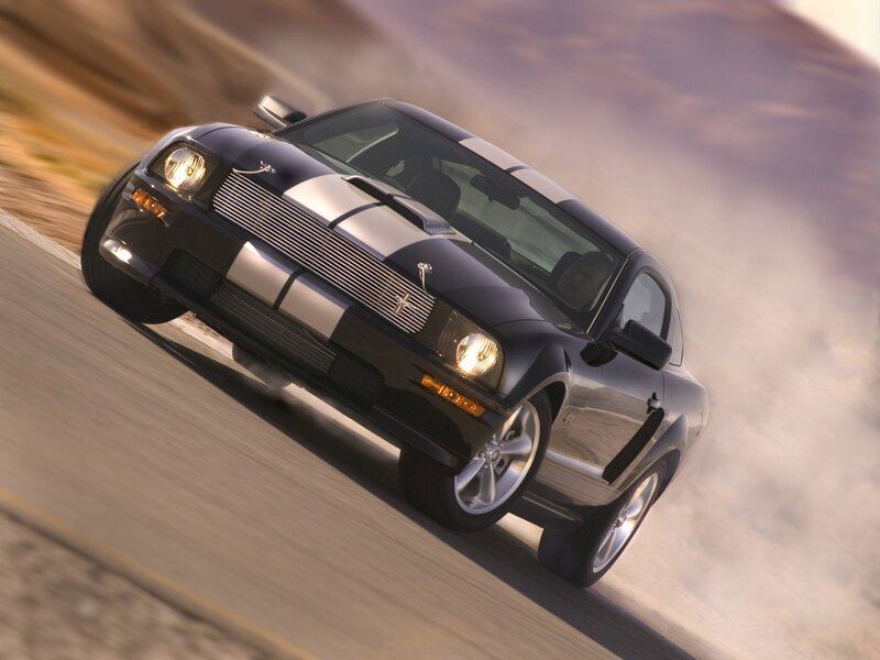 Black Ford Mustang GT in motion
