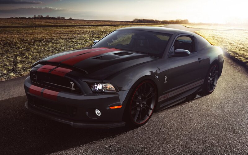Black Ford Mustang GT on country road