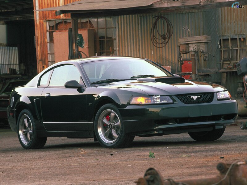 Black Ford Mustang in a garage