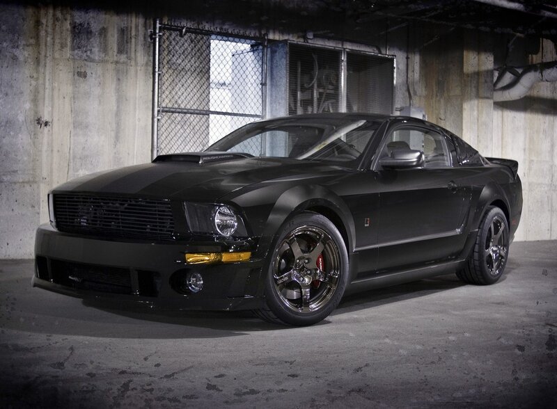 Black Ford Mustang in garage