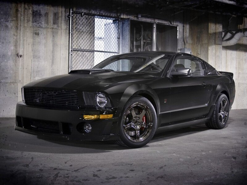 Black Ford Mustang in garage