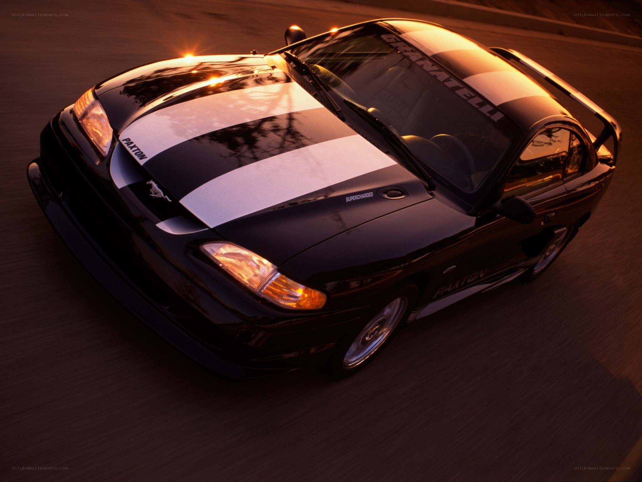 Black Ford Mustang in motion
