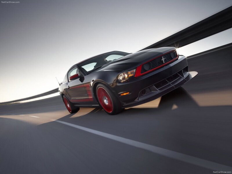 Black Ford Mustang on a highway