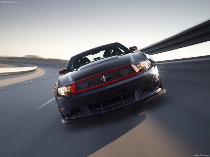 Black Ford Mustang on a racetrack