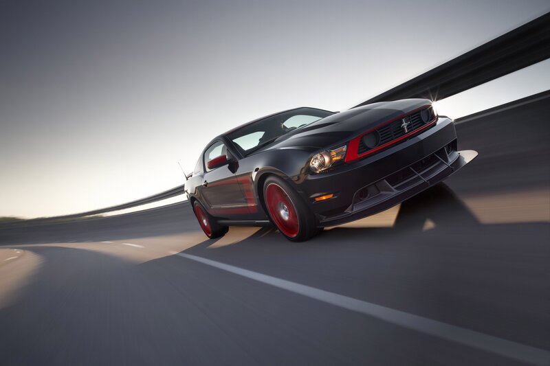 Black Ford Mustang on a racetrack