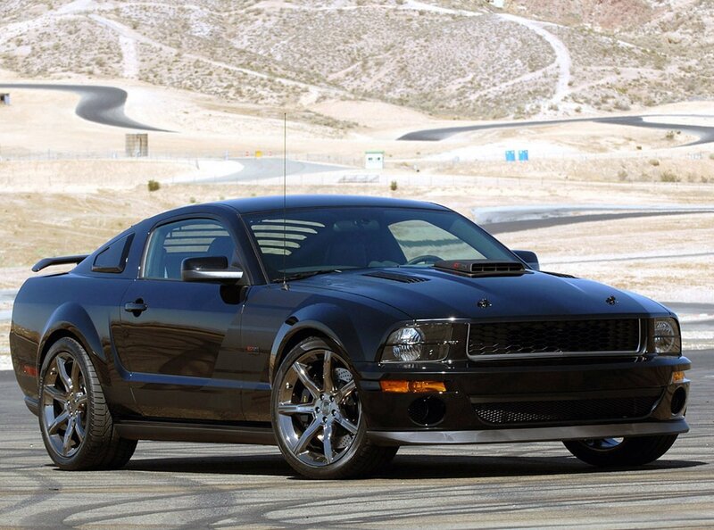 Black Ford Mustang on a racetrack