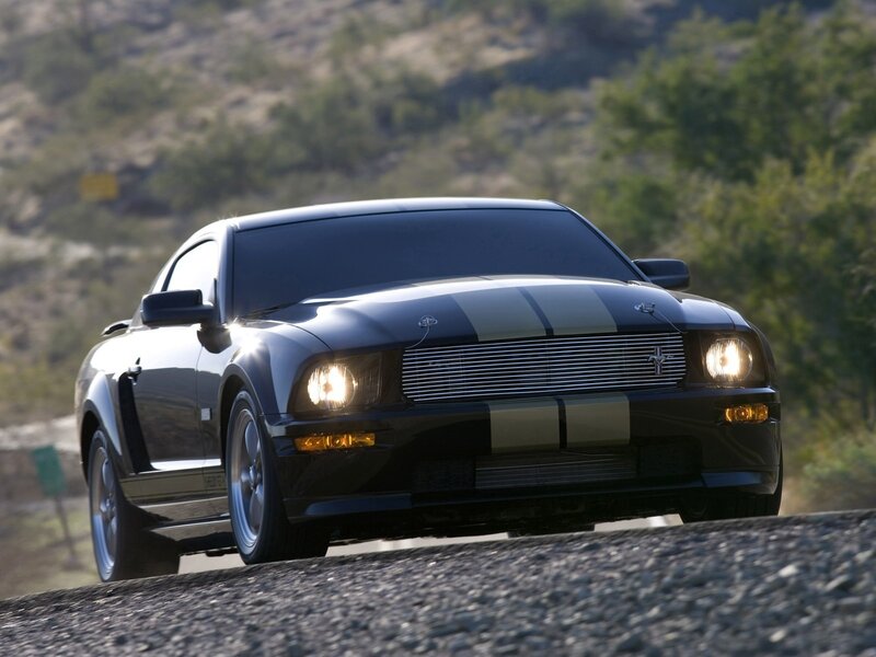 Black Ford Mustang on a road